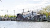 Former boat association building collapses into Lemon Creek (photos)