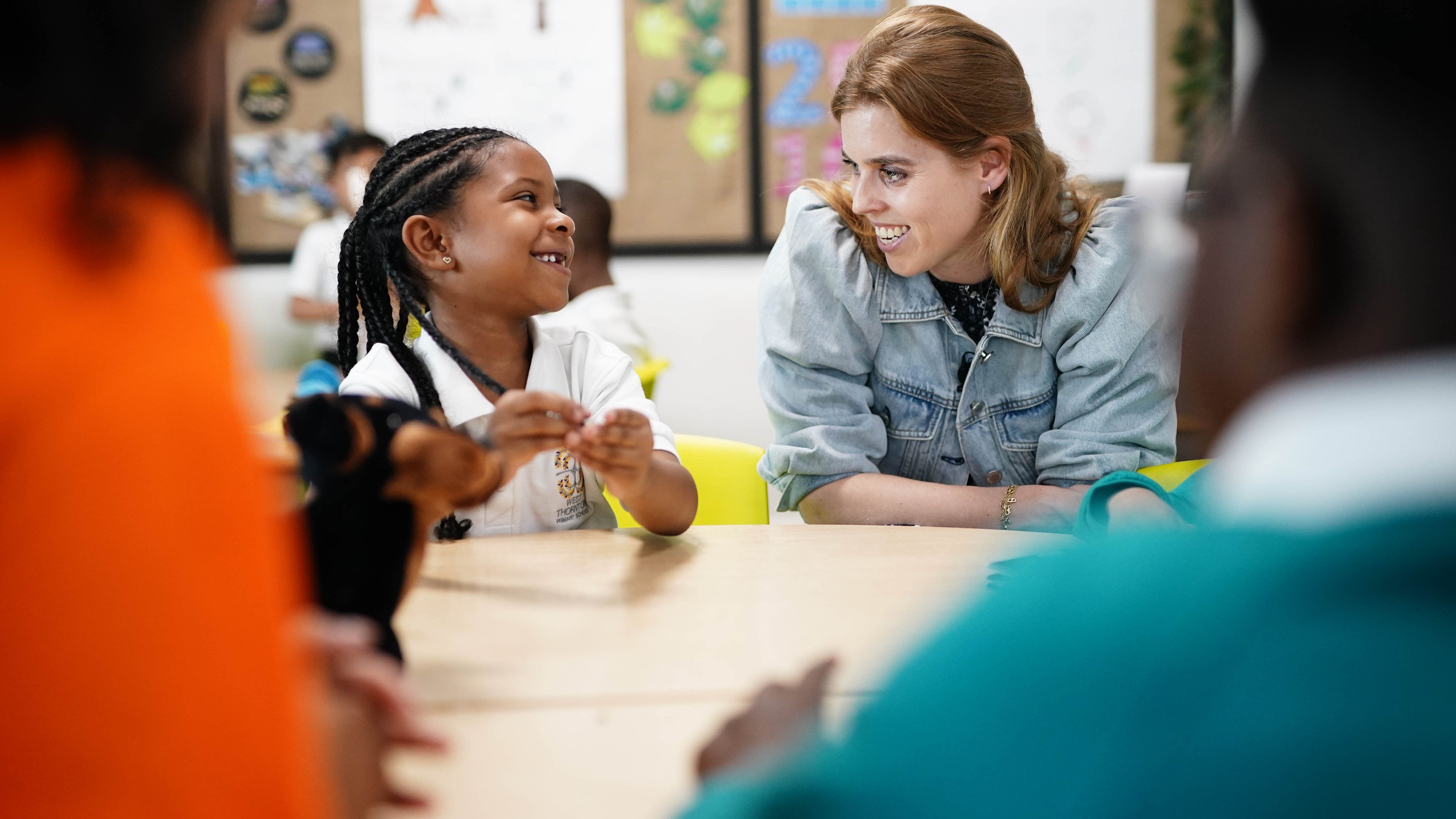 Princess Beatrice praises her mother on school visit to read prize-winning book