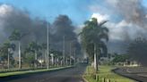 ‘Balaclavas and big sticks’: New Caledonia tourists trapped by riots