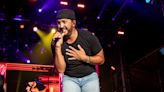 Luke Bryan Jokes His ‘Lawyer Will Be Calling’ After He Slips on Fan’s Phone and Falls On Stage