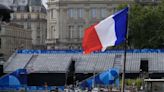 Thousands of fans take place along River Seine for rainy Olympic opening ceremony