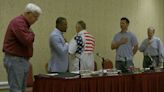 Louisiana's PSC meets in room with no American flag. How did it improvise for Pledge of Allegiance?