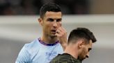 Bruised Ronaldo scores twice to edge showdown with Messi