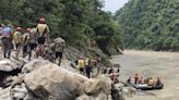 Rescuers in Nepal recover 11 bodies after a landslide swept 2 buses full of people into a river