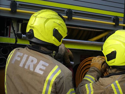 Around 100 firefighters tackling double house blaze in east London