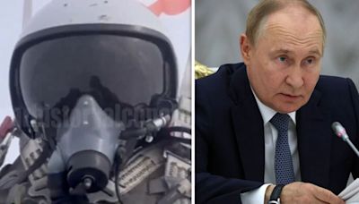 Astonishing moment Russian pilot is shot out of his burning warplane