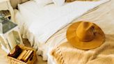 Wait, Why Aren't You Supposed To Put Hats on Your Bed? The Superstition—Explained