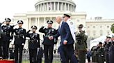 Biden trips on stage at fallen officer's event