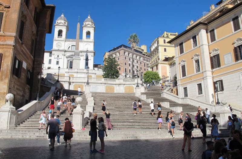 Italian femicide activists paint Rome's Spanish Steps red