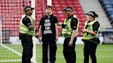 Protestor chains himself to a goalpost ahead of Scotland-Israel women's match