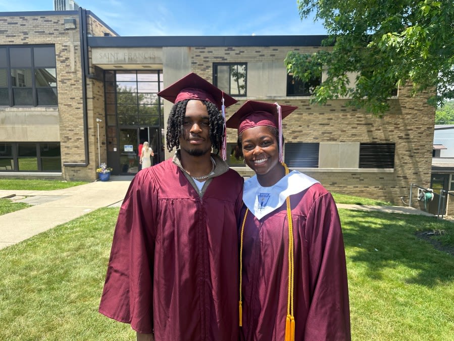 Seniors walk through St. Francis de Sales Catholic School before graduation