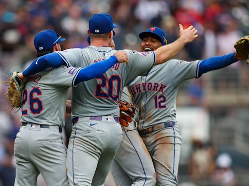 Mets top Braves 8-7 in first game of doubleheader to clinch NL playoff berth; Braves against the wall