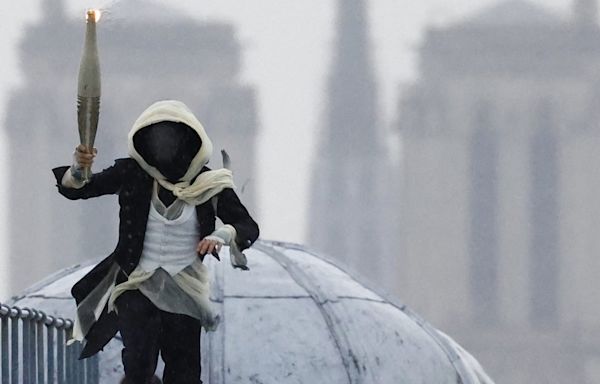 Assassins Creed? Who was the masked torchbearer at the 2024 Paris Olympics Opening Ceremony?