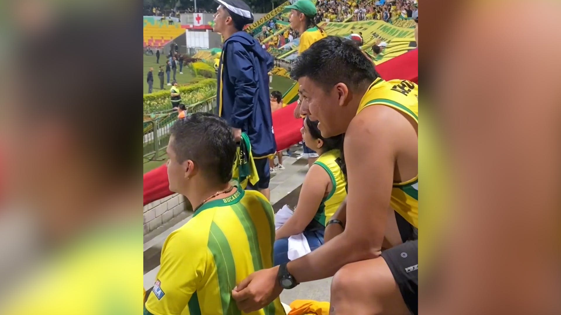 Watch this soccer fan's unique way of helping a friend who is blind follow a game