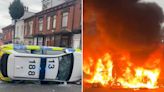 Bus set on fire and police car flipped over as unrest breaks out in Leeds with hundreds out on streets