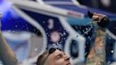 Caeleb Dressel celebrates his victory in the 100m butterfly at the US Olympic swimming trials