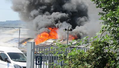 Warning to 'keep away' as large fire breaks out at industrial site | ITV News