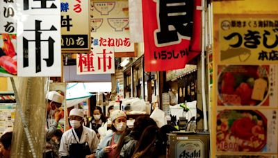 Japan plans record hike in minimum wage, NHK reports