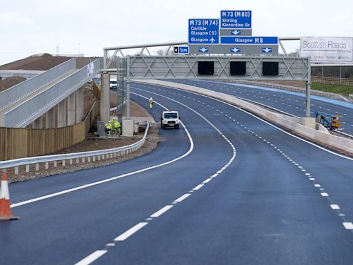 Three people including police officer fighting for lives after M8 hit-and-run