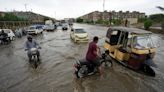 Flash flooding triggered by heavy monsoons in northwest Pakistan kills at least 14 people