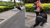 Watch: Chinese dad kneels in public for being unable to buy daughter an iPhone