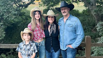 Tiffani Thiessen rocks a cowboy hat and vest in rare family photo