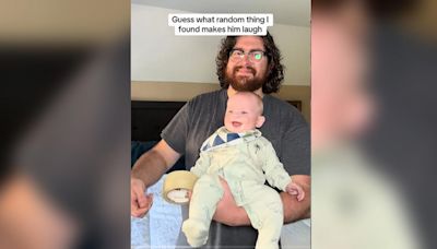 Dad makes baby laugh hysterically with the sound of duct tape