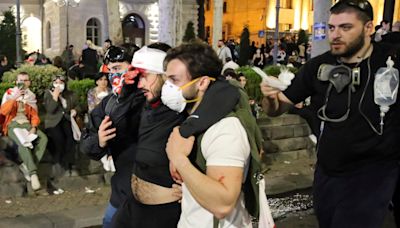 Georgia parliament cancels session after building damaged during huge protests