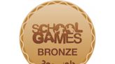 Two primary schools receive sporting award after competing in school games