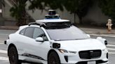 Video shows police yelling at a driverless Waymo taxi to stop it from running over a fire hose