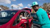 North Fort Myers graduate ZaQuandre White, Miami Dolphins players hand out supplies in Lee