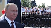 Putin looks like he'd rather be anywhere else at Russia's Grand Naval Parade