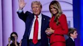 Melania surprises Trump on stage after speech in rare show of affection