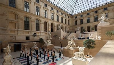Olympics-Parisians warm up for Olympics with workouts in Louvre museum