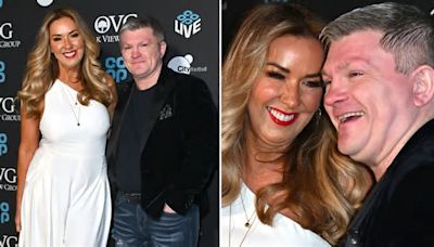 Loved-up Claire Sweeney and Ricky Hatton cosy up for first red carpet as the couple attend arena launch in Manchester