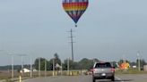 Three suffer burns when hot-air balloon hits power lines in Indiana