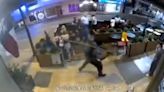 Moment random man smacks bar patron over the back of the head