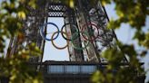 The Olympic rings go up on the Eiffel Tower