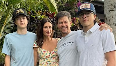 Mark Wahlberg can't believe his teen sons are 'taller than me already' as Michael, 18, and Brendan, 15, tower over him in rare family photo from Hawaii