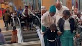 Strangers Lend A Hand To Help Frightened Children On Their First Escalator Ride