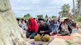 Indonesians pray outdoors after deadly quake destroys town