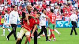 Olympic football off to violent, chaotic start as Morocco fans rush the field in team's stunning win over Argentina