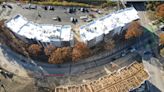 Down the hill from UC, a student complex rises along I-75