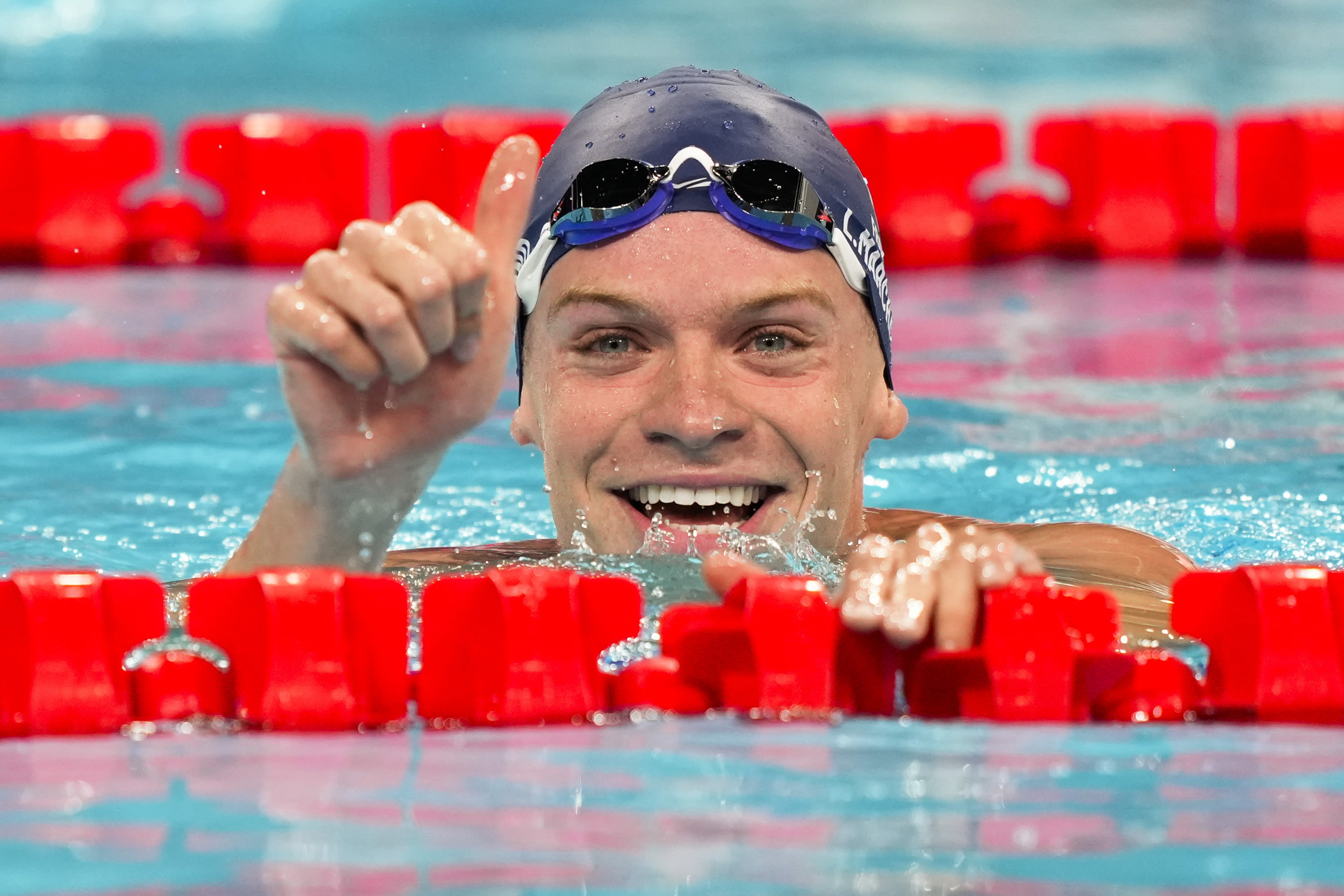 With French fans cheering every stroke, Marchand cruises to fastest time in men's medley