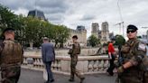 Central Paris locks down for Olympics as athletes arrive