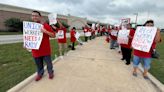 Austin airport workers picket for better pay