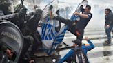 Argentine riot police disperse protesters with water cannons and tear gas ahead of key Senate vote