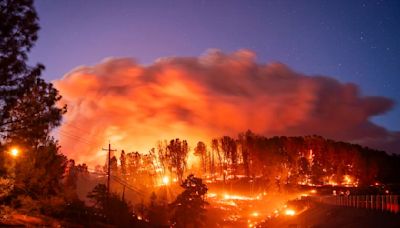 California's largest wildfire doubles in size and destroys scores of buildings