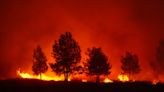 Flames 'right by our front door': Wildfires rage across western US