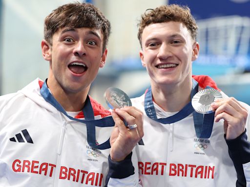 Tom Daley wins silver to complete set of Olympic medals — and is then soaked in fruit juice by son